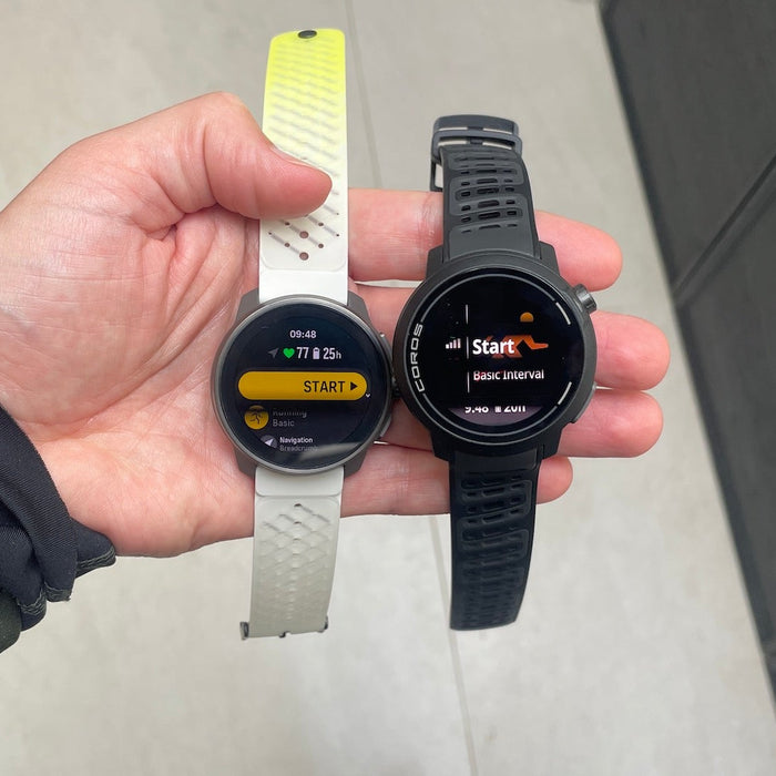 The Suunto Race S and Coros Pace Pro next to each other in reviewer Kieran's hand