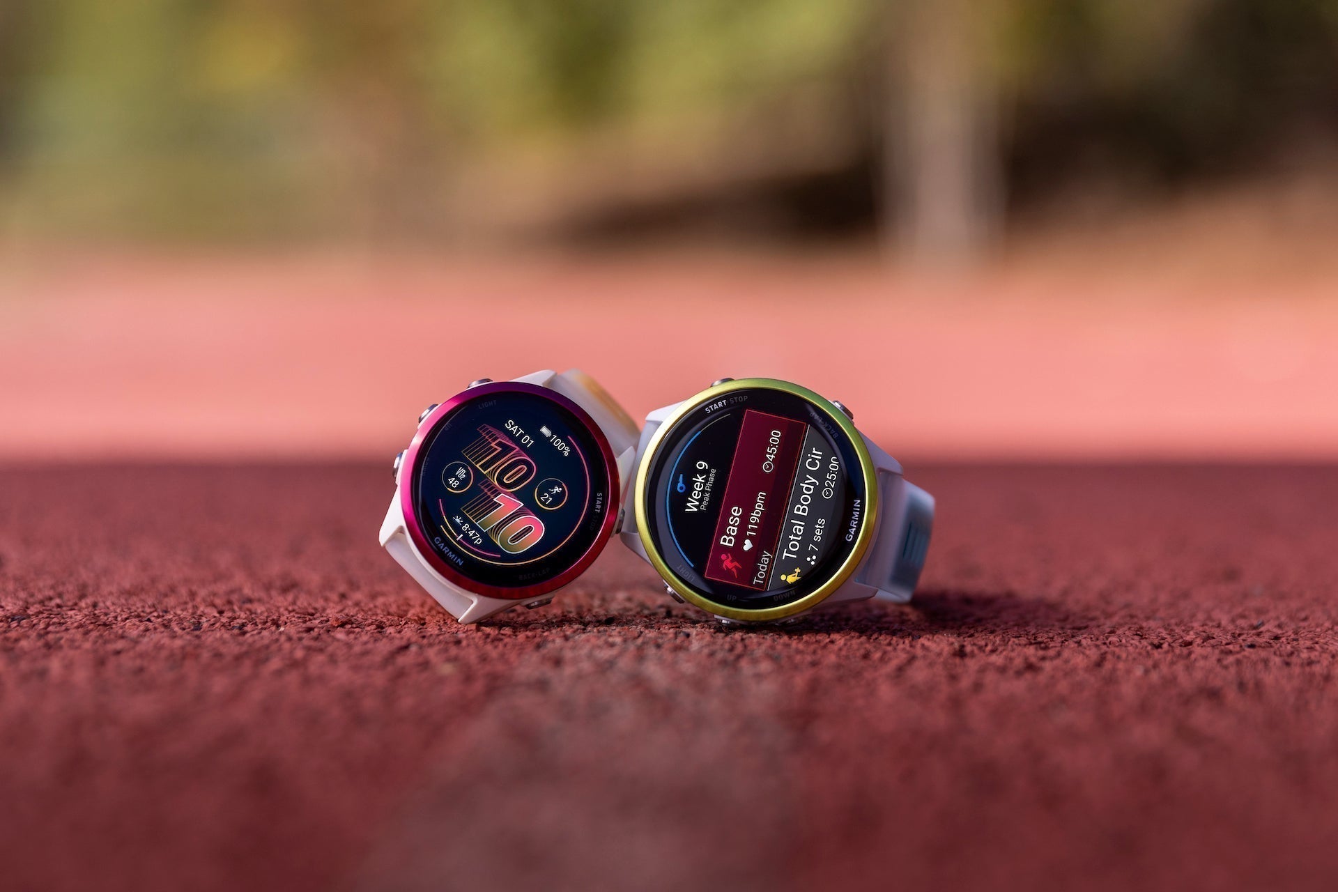 The 42mm and 47mm Garmin Forerunner 570 running watches on the track