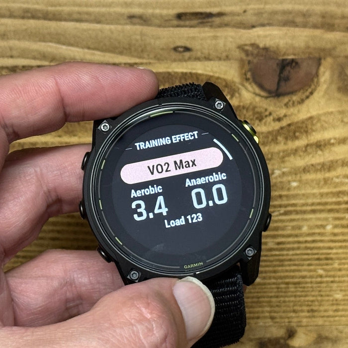 The Garmin Enduro 3 ultra watch held by reviewer Kieran Alger showing VO2 Max on display