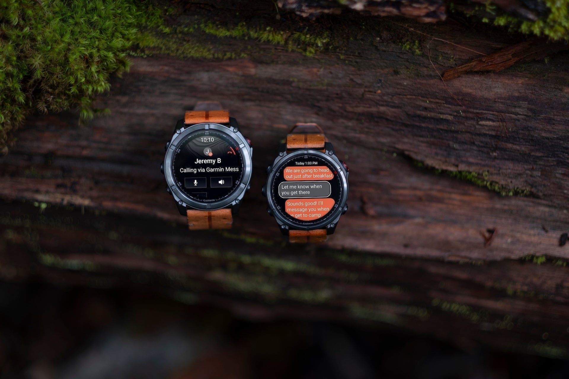 Both sizes of the Garmin fenix 8 Pro multisport watches on a log outdoors with messaging on the display