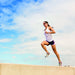 Woman running while using the Garmin HRM-Run