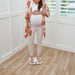 Pregnant woman on her monthly weigh in using the Garmin Index S2 Smart Scale